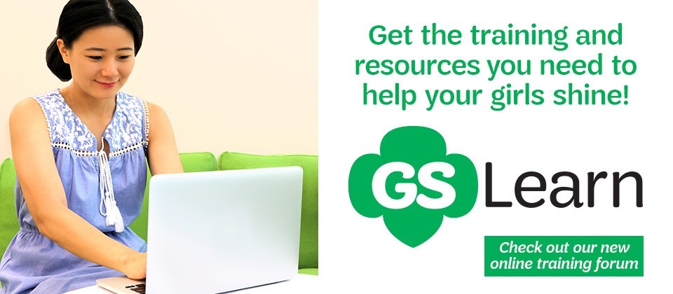 Troop leader using a laptop with text, Get the training and resources you need to help your girls shine! Check out our new online training forum.
