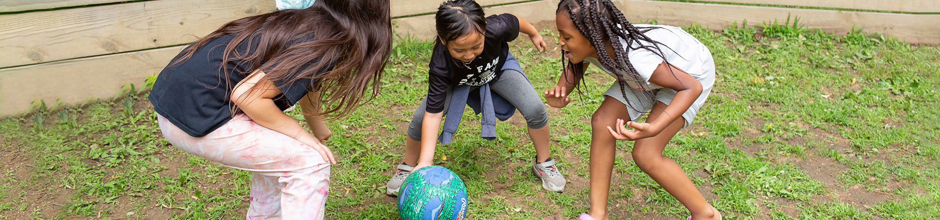  Girls playing the Gaga Ball game outside 