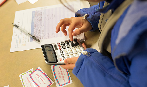 Girl Scout using a calculator