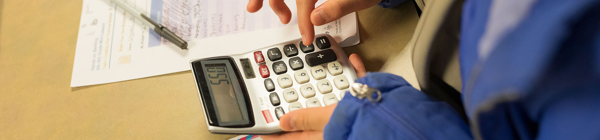  Girl Scout using a calculator 