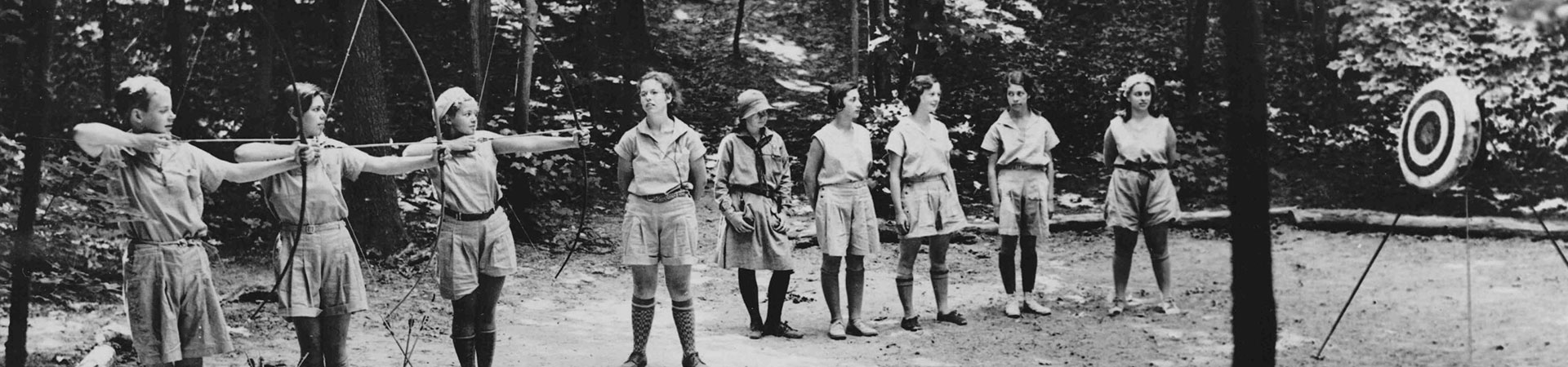  Girl Scouts practicing archery in 1912 