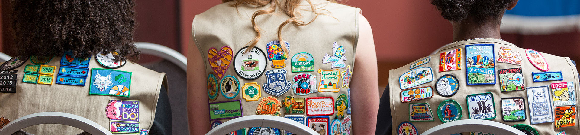  Girls in Vest uniforms filled badges and patches 