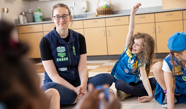 Daisies in a circle with a Girl Scout Volunteer