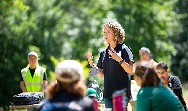 a Volunteer giving instructions to group 