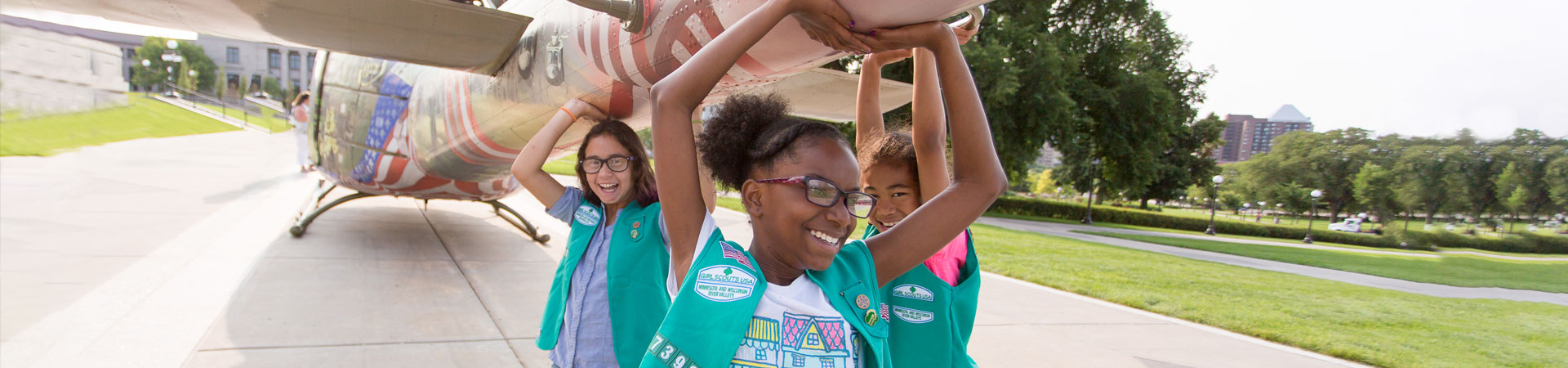  Girl Scouts pretend to support a helicopter outside the Minnesota State Capitol 